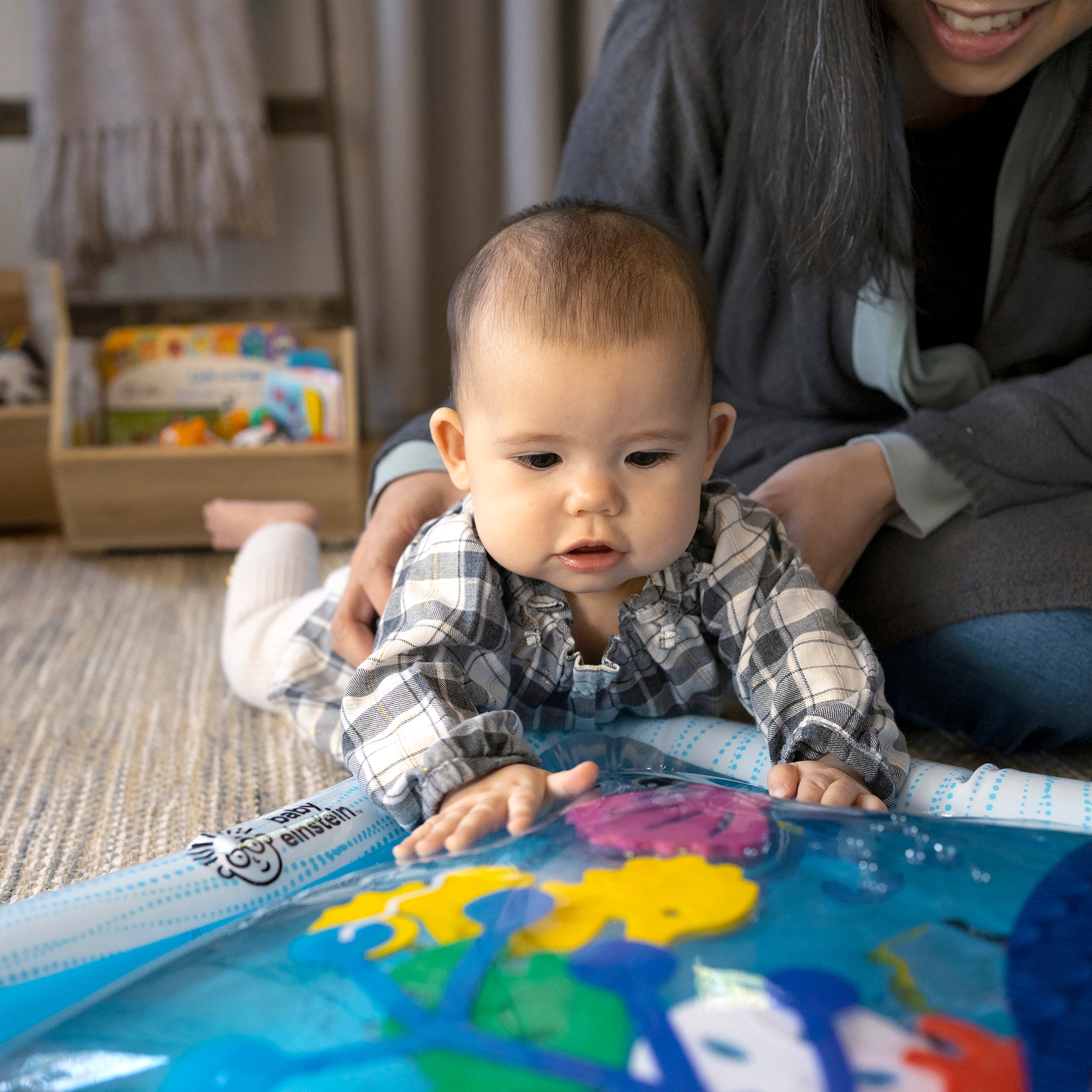 baby playing with water mat
