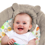 Smiling baby seated in Winnie the Pooh Baby Bouncer with soft cushioned headrest and playful character toy bar