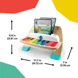Baby Einstein Magic Touch Piano Musical Toy with color-coded keys and music sheets.