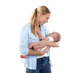 Mother holding baby, showcasing the Ingenuity SmartBounce Automatic Bouncer - Braden.