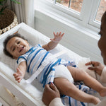 baby using a summer by ingenuity contoured changing pad