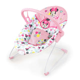 baby in a minnie mouse spotty dotty vibrating bouncer for babies