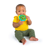 Baby enjoying Bright Starts Soothers & Shakers 7-Piece Gift Set, green teether in hand.