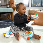 baby playing with a small symphony 3-piece musical toy set