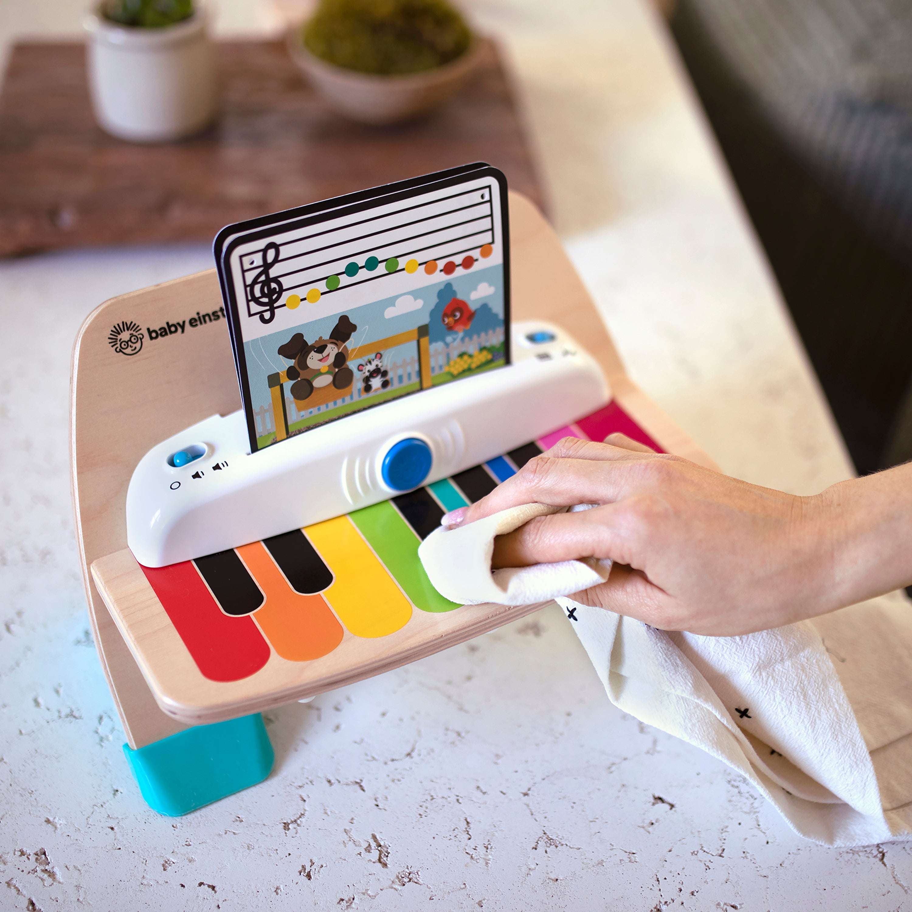 Baby Einstein Magic Touch Piano Musical Toy with color-coded keys and music sheets.