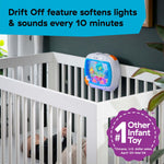 Baby Einstein Sea Dreams Soother™ attached to crib, featuring gentle lights and ocean sounds for baby sleep aid.
