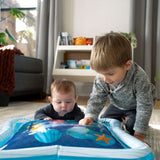 Baby and toddler playing with Baby Einstein Opus’s Ocean of Discovery™ Tummy Time Water Mat.