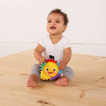 baby playing with a star bright symphony take-along toy