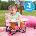 Minnie Mouse Pop ‘N Sit™ Portable Booster Seat for toddlers and babies, outdoor setting.