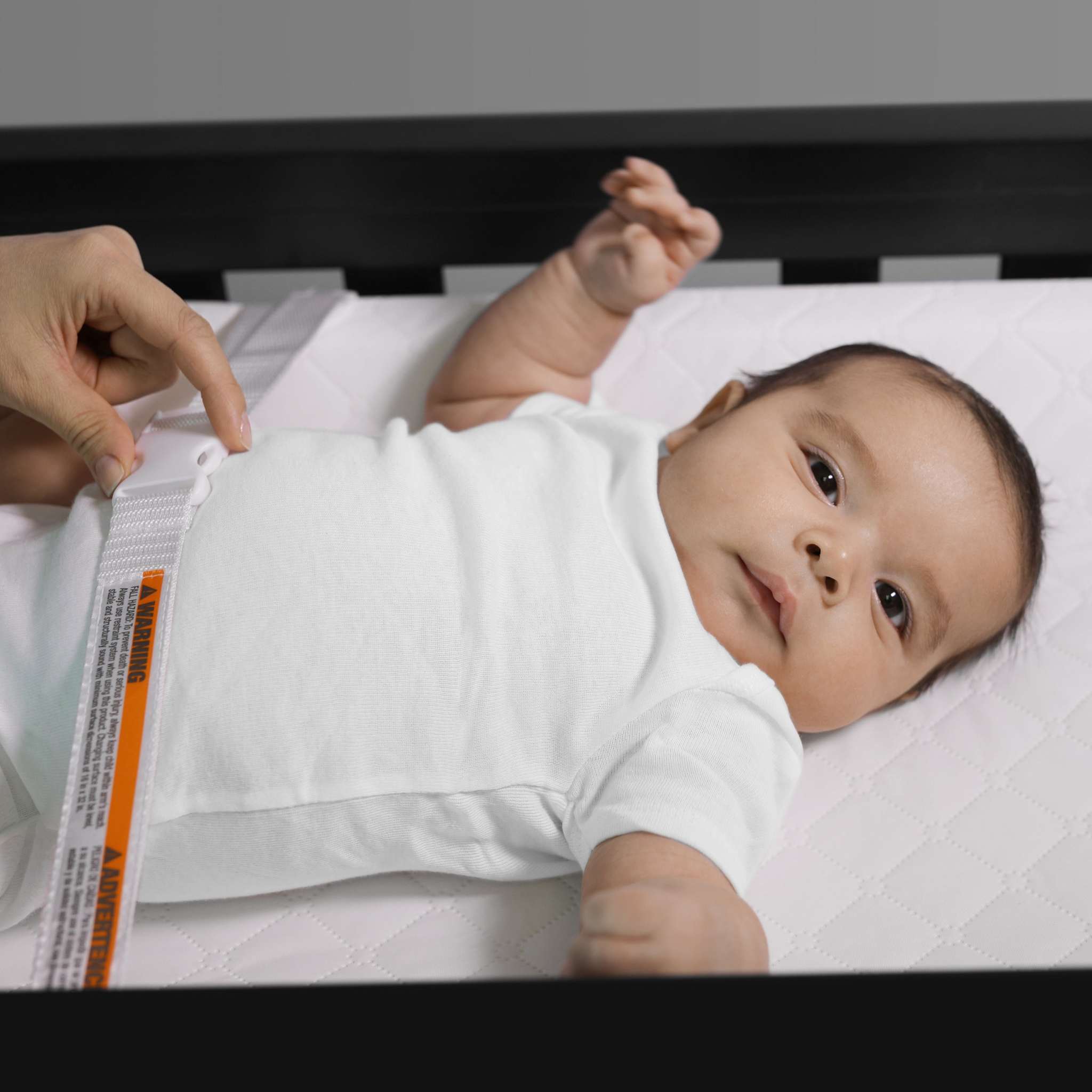 baby using a summer by ingenuity contoured changing pad