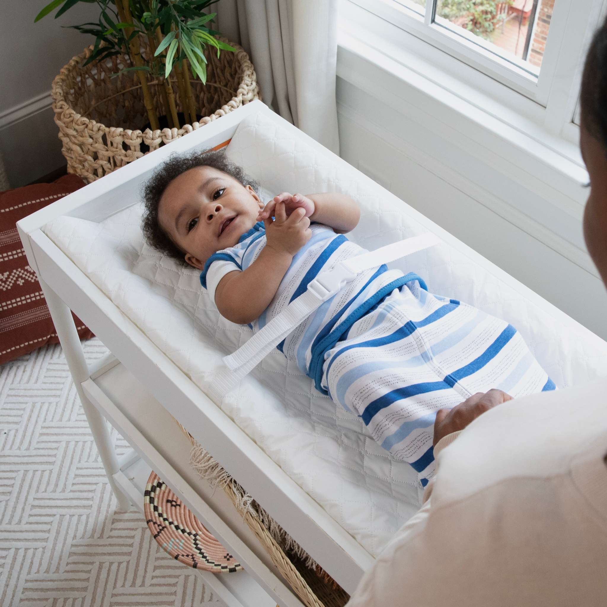 baby using a summer by ingenuity contoured changing pad