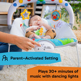 Baby enjoying Baby Einstein Kick to It Neptune Musical Bouncer with toys and parent-activated settings.