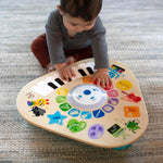 baby playing with clever composer tune table magic touch activity toy