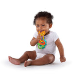 Baby with Bright Starts Soothers & Shakers teether from the 7-Piece Gift Set.