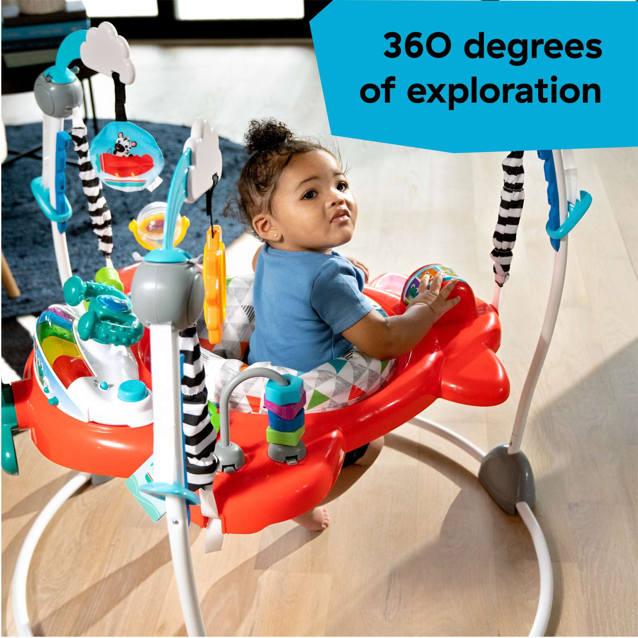 Baby enjoying the Baby Einstein Airplane Adventure 2-in-1 Activity Jumper with interactive toys and 360-degree rotating seat.