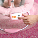 MINNIE MOUSE Rosy Skies Comfy Bouncer with soothing vibrations and playtime toys.