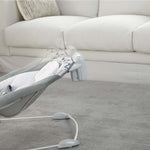 Ingenuity SmartBounce Automatic Bouncer - Braden with plush seat and toy bar in living room setting.