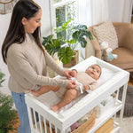 baby using a summer by ingenuity contoured changing pad