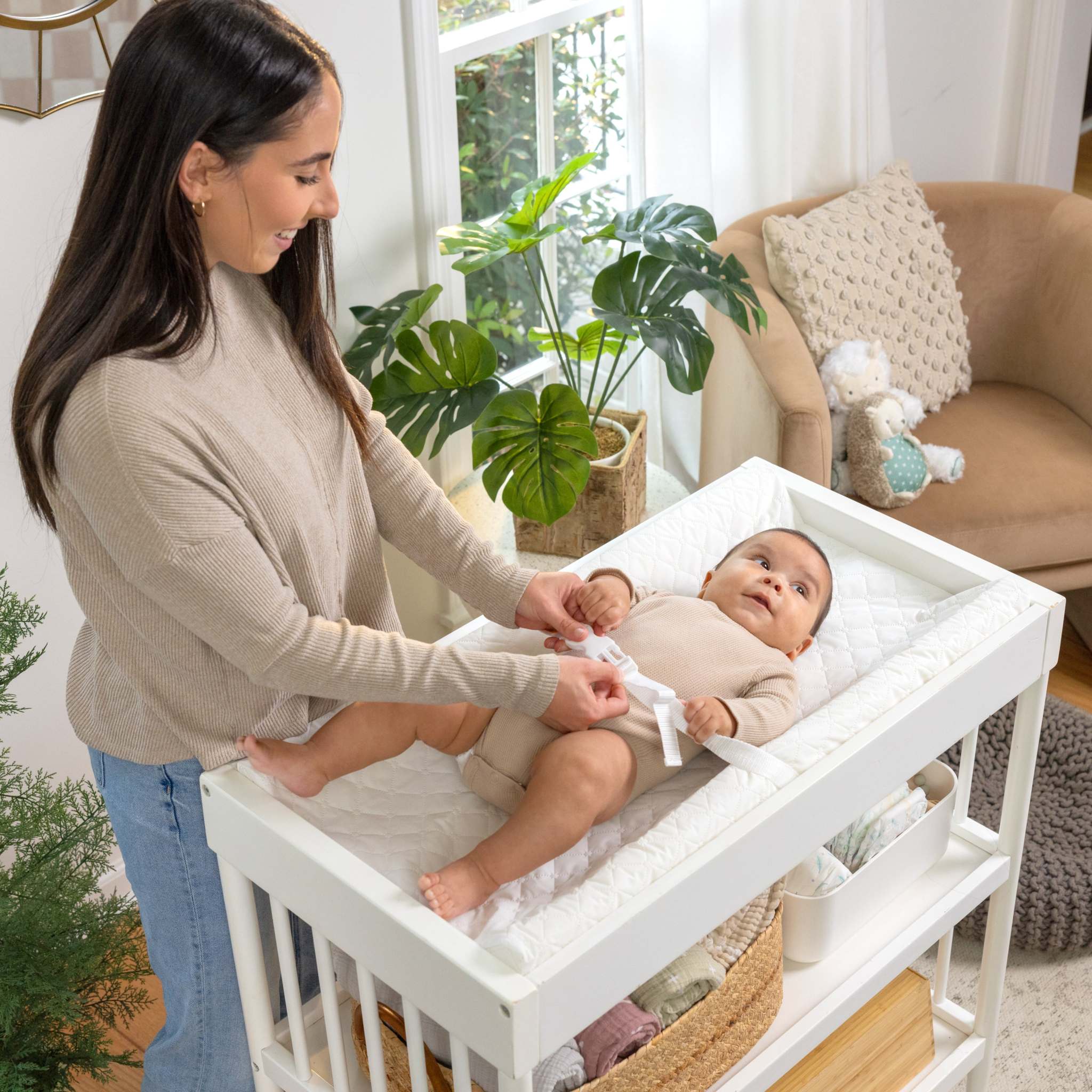baby using a summer by ingenuity contoured changing pad