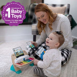 Baby playing with Magic Touch Piano musical toy, promoting creativity and music appreciation.