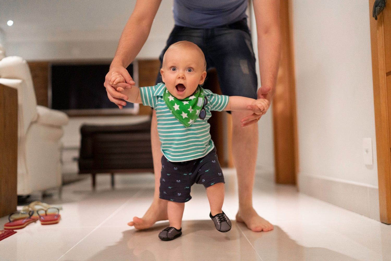 baby walking with mom