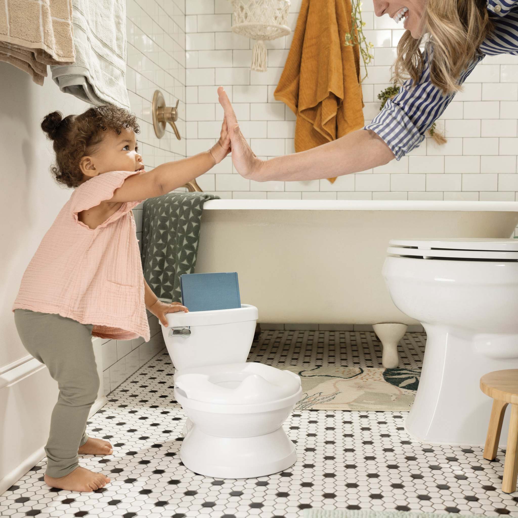 Ergonomic Ingenuity Potty training seat with splash guard and removable bowl for comfortable toddler potty training