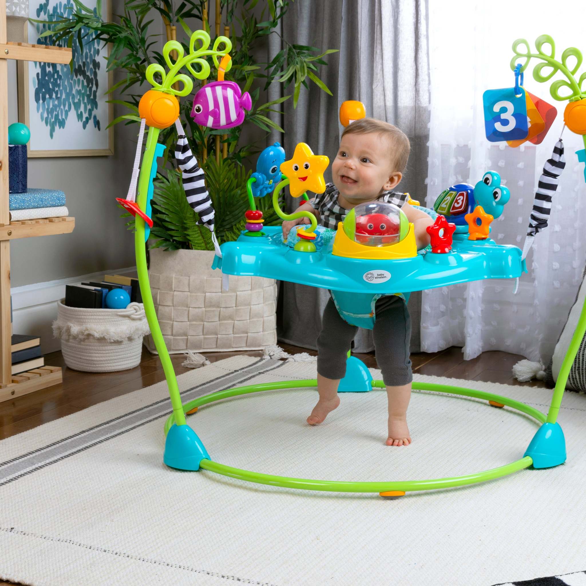 6-12 months baby playing with developmental toys supporting crawling, standing, and coordination milestones