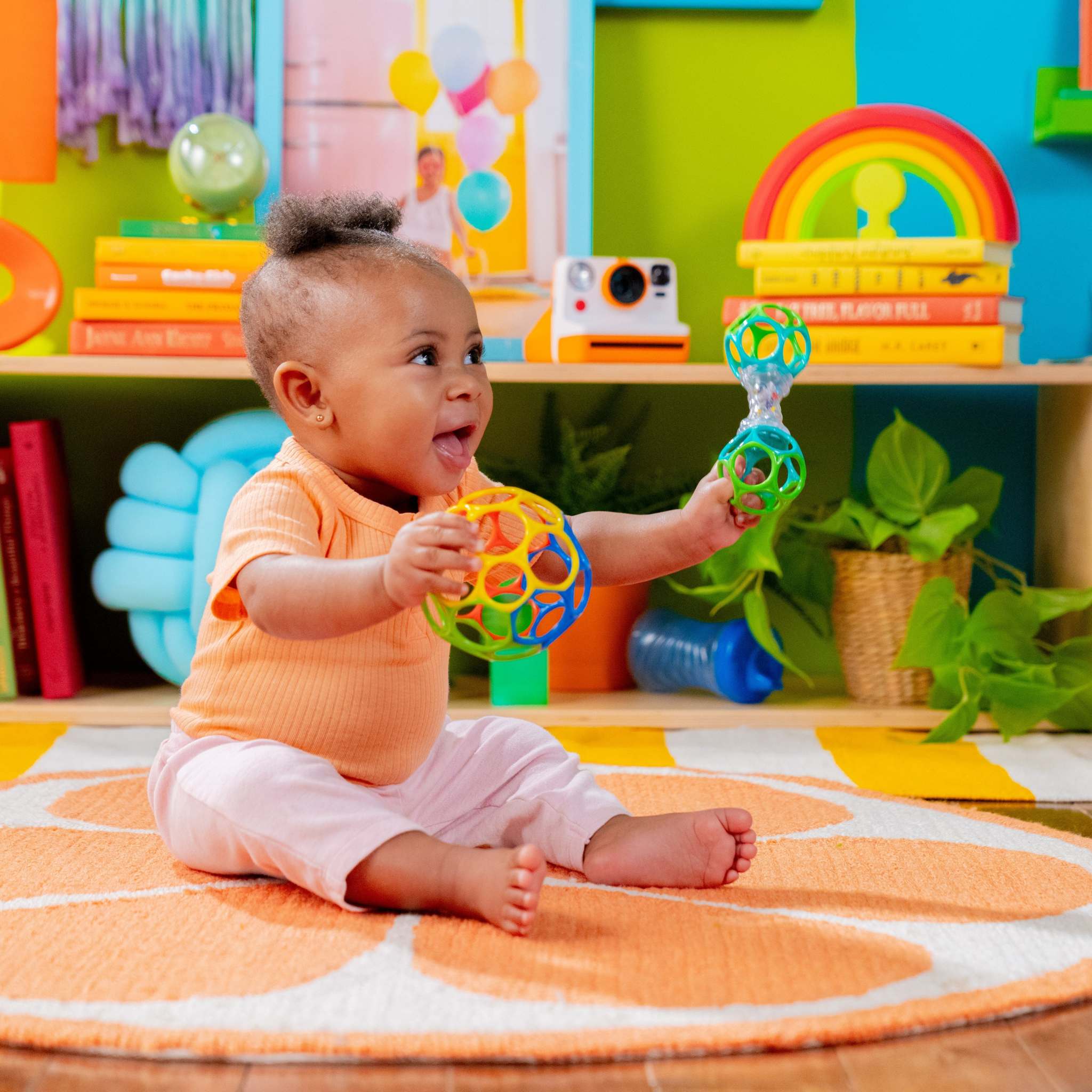 Colorful fine motor development toys for babies from Baby Einstein, Bright Starts, and Ingenuity