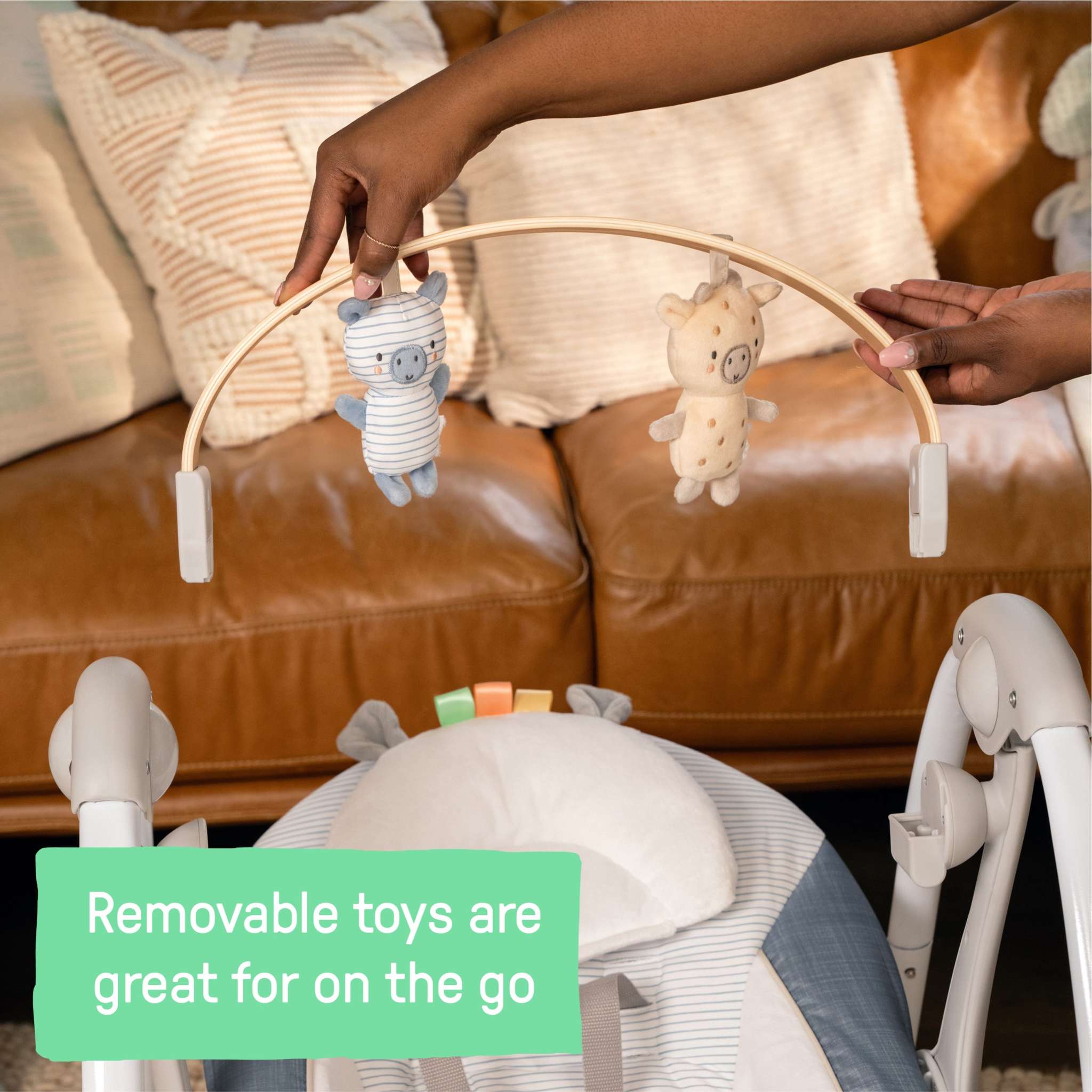 Ingenuity Swing ‘n Go Portable baby swing with removable toy bar and plush seat in chambray