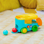 Bright Starts Pop & Roll Safari Bus baby toy with jungle theme, lights, sounds, and rolling ball play features