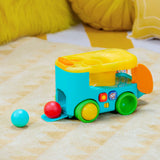 Bright Starts Pop & Roll Safari Bus baby toy with jungle theme, lights, sounds, and rolling ball play features