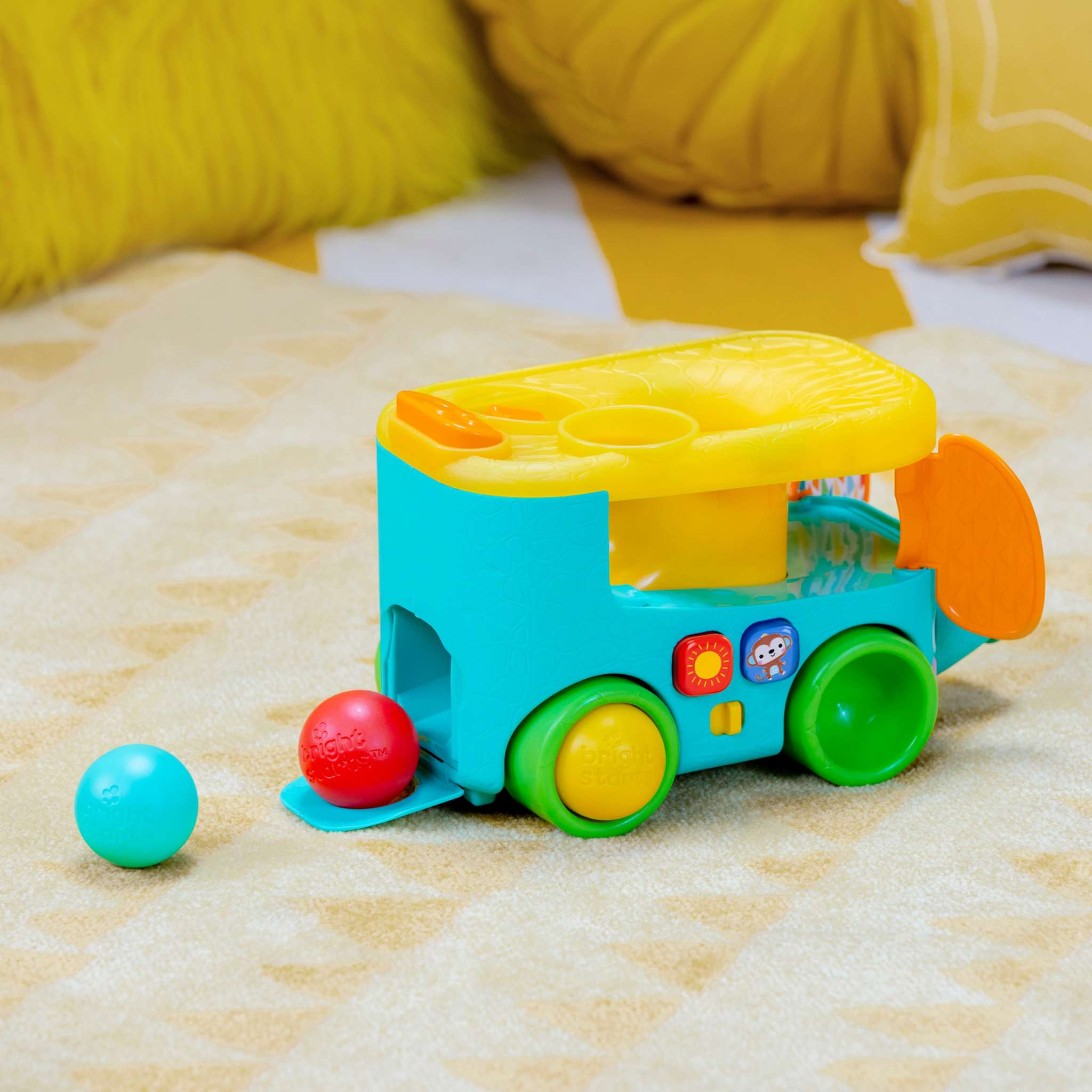 Bright Starts Pop & Roll Safari Bus baby toy with jungle theme, lights, sounds, and rolling ball play features
