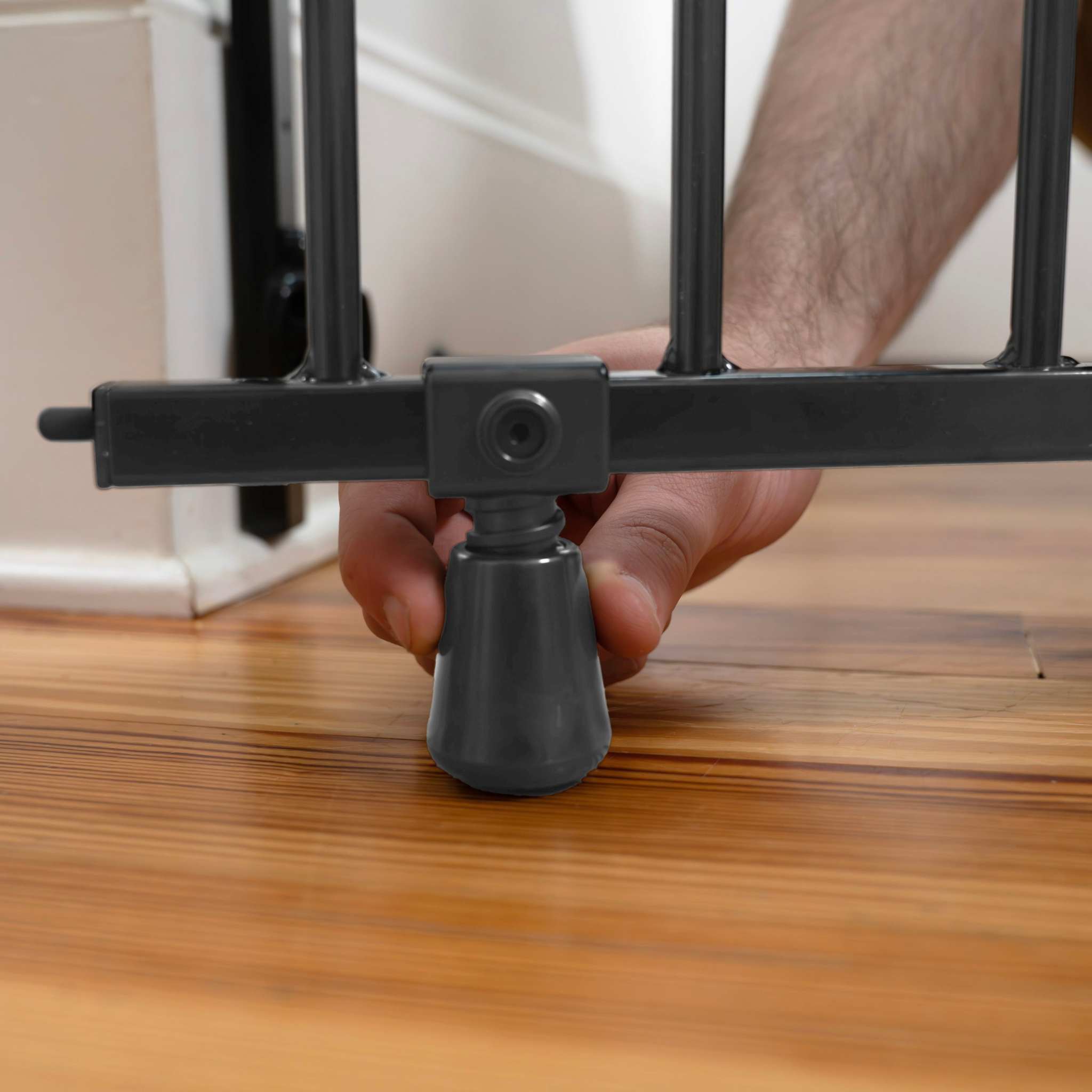 Ingenuity Stairway+ 46W Series black metal baby and pet safety gate installed in doorway