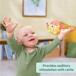 Disney Baby Winnie the Pooh sensory rattle toy held by smiling baby for auditory stimulation