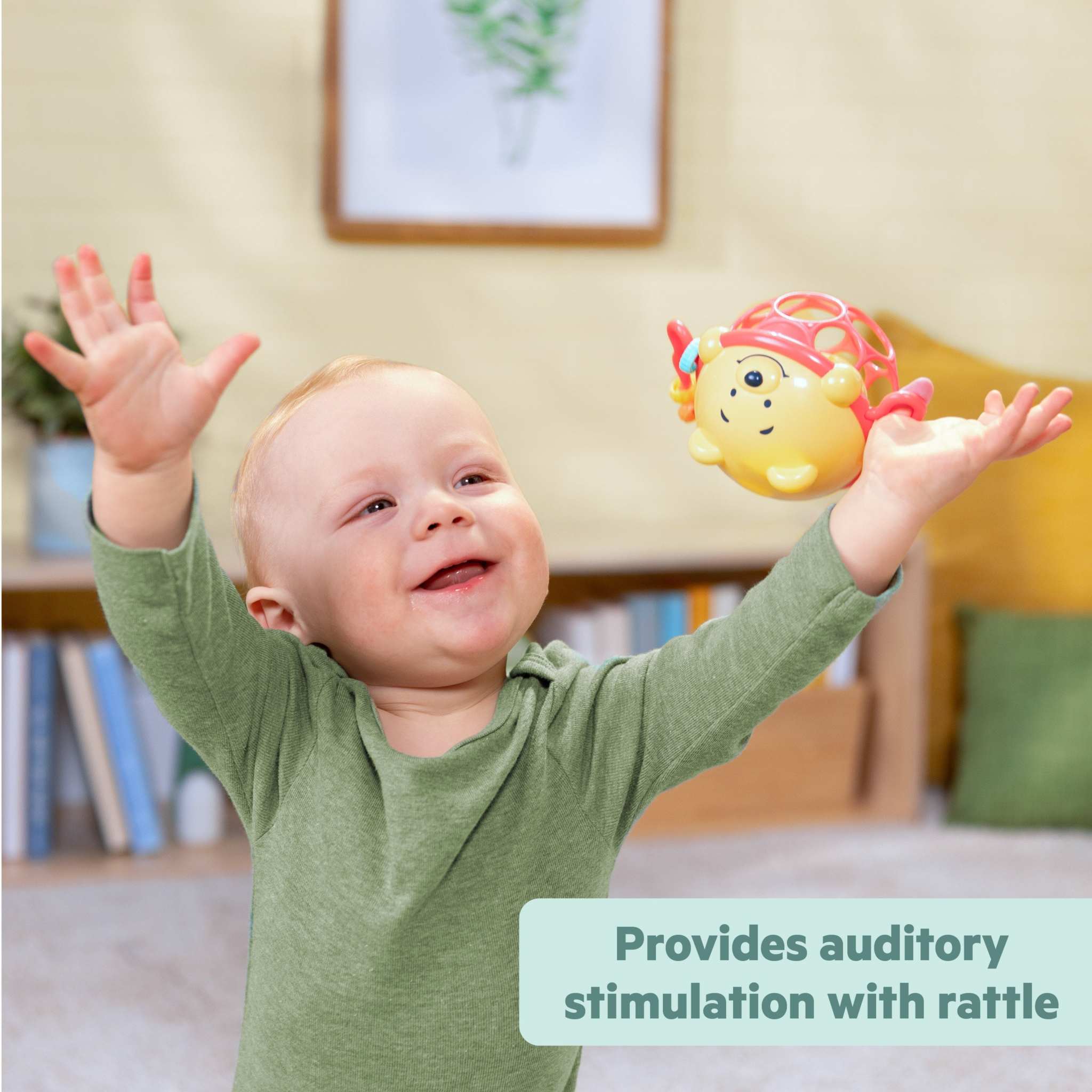 Disney Baby Winnie the Pooh sensory rattle toy held by smiling baby for auditory stimulation