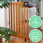 Ingenuity The Stairway 48W Series brown wood safety gate for stairs and hallways with locking indicator and comfort grip handle