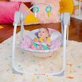 Bright Starts Pink Paradise Portable Swing with interactive toys and adjustable recline for babies