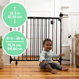 Ingenuity Stairway+ 46W Series black metal dog and baby safety gate installed in a doorway