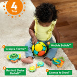 Baby playing with Bright Starts Catch Me Smile gift set featuring 4 colorful infant toys for teething and motor skill development