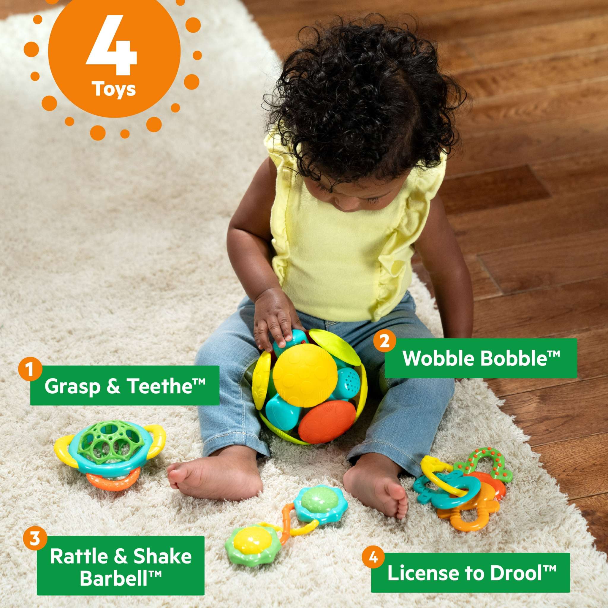 Baby playing with Bright Starts Catch Me Smile gift set featuring 4 colorful infant toys for teething and motor skill development