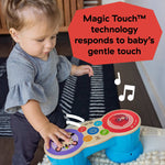 Baby playing with Baby Einstein First Tunes Magic Touch Drum musical toy set