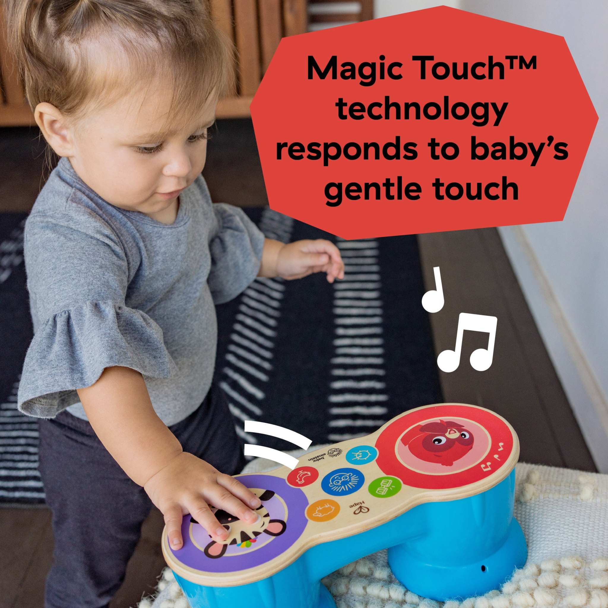 Baby playing with Baby Einstein First Tunes Magic Touch Drum musical toy set