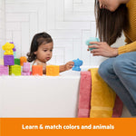 Baby playing with Bright Starts Cubes & Cuties colorful animal toys and stacking blocks in bathtub with adult helper