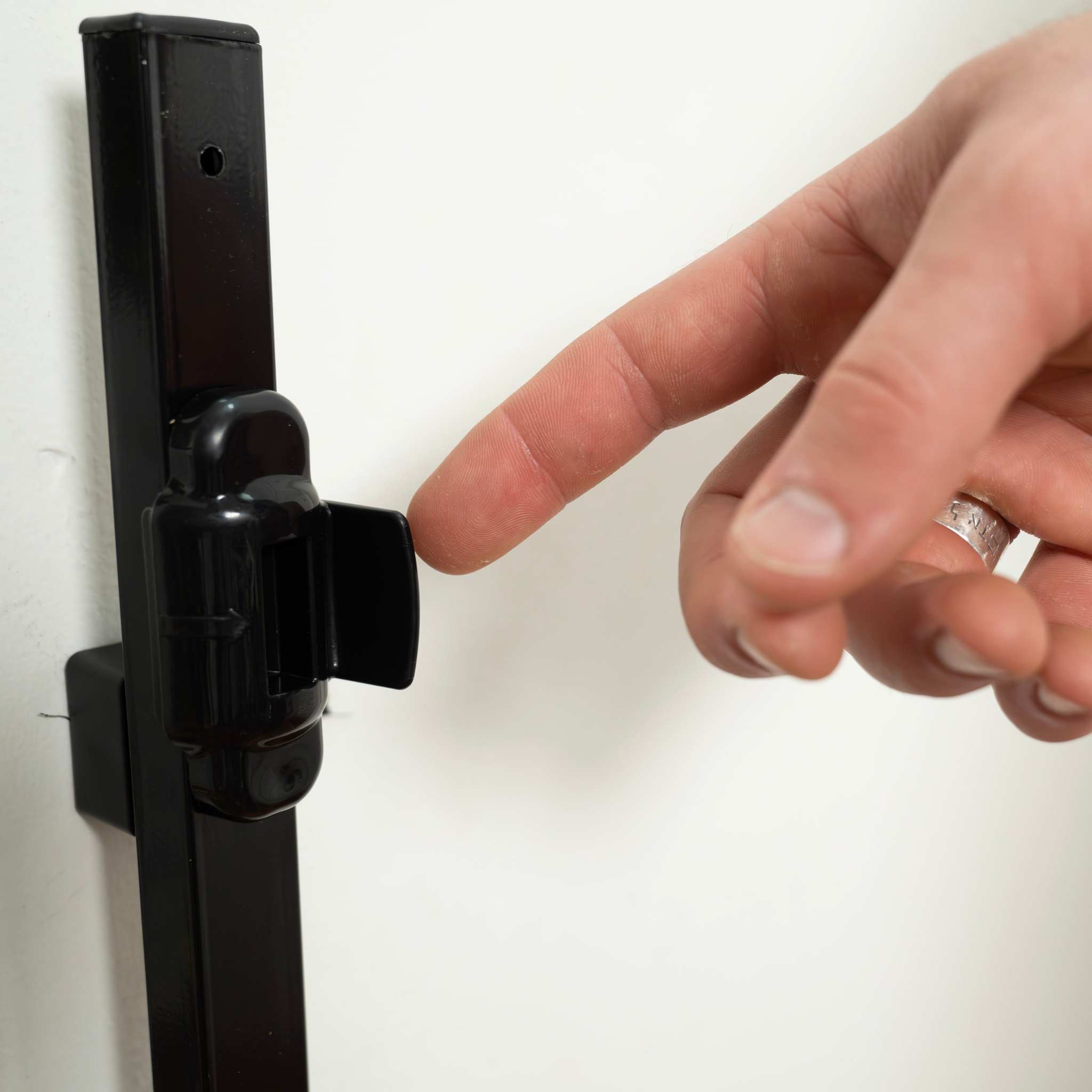 Ingenuity Stairway+ 46W Series black metal baby and pet safety gate installed in a doorway