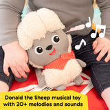 Baby playing on Happy Harvest Touch & Feel Activity Gym with sensory toys and colorful barnyard mat