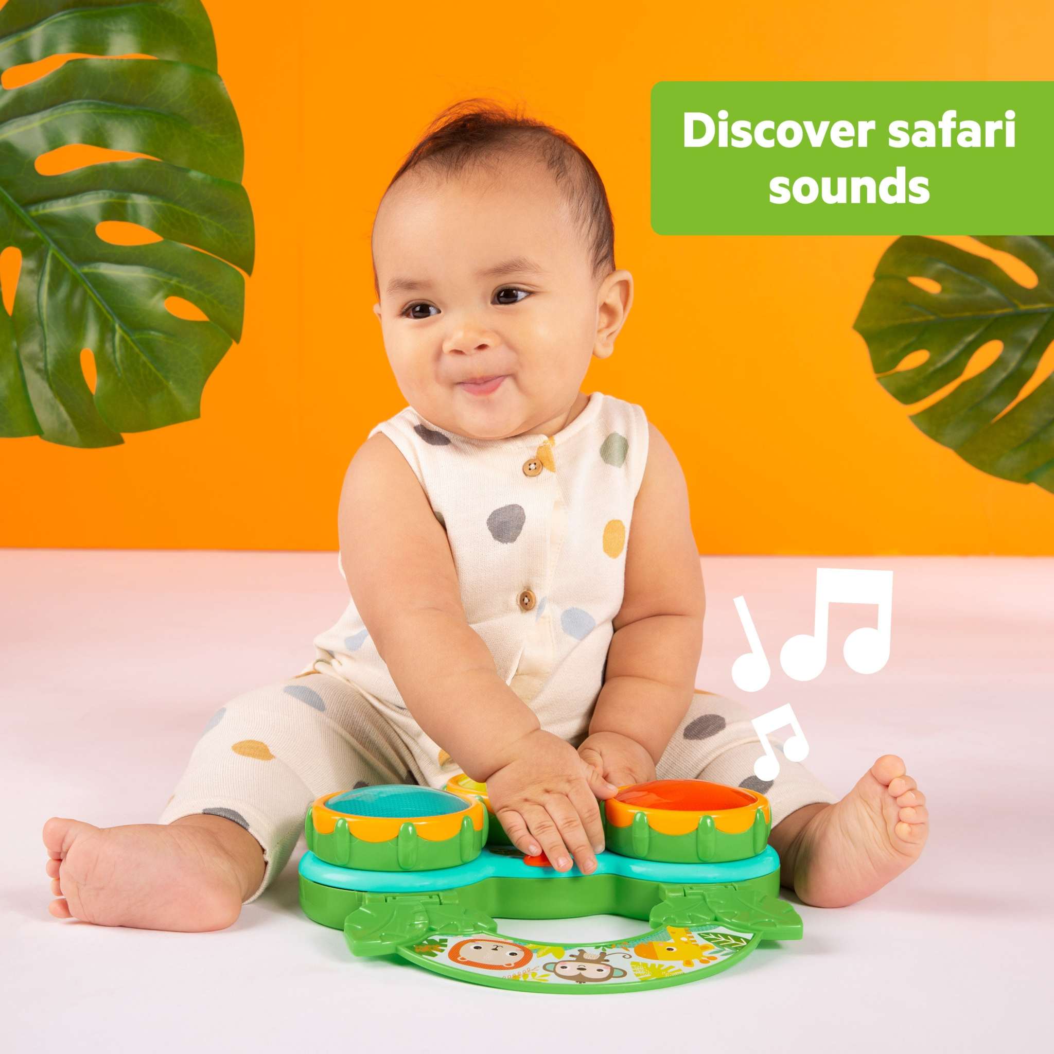 Baby playing with Bright Starts Safari Sounds Gift Set musical drum toy with colorful lights and jungle animal designs