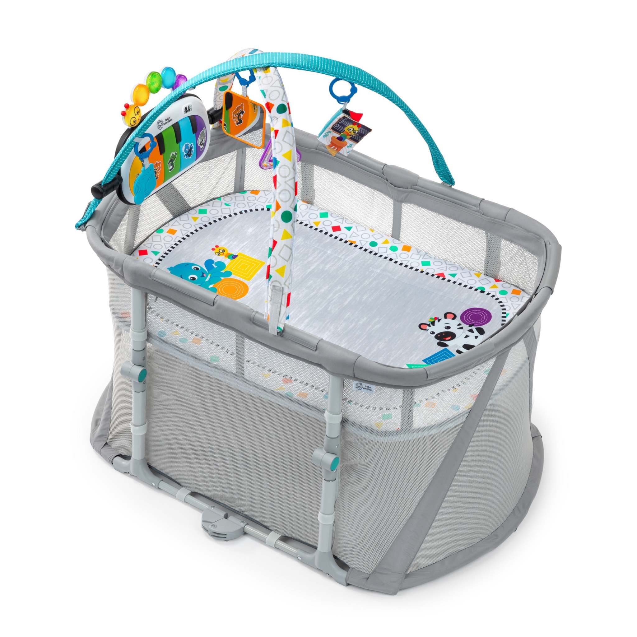 Kick & Snooze 3-in-1 Playard with toy bar, mesh sides, and piano for infant sleep and activity.