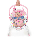Minnie Mouse Spotty Dotty vibrating baby bouncer with pink polka dots and two hanging toys