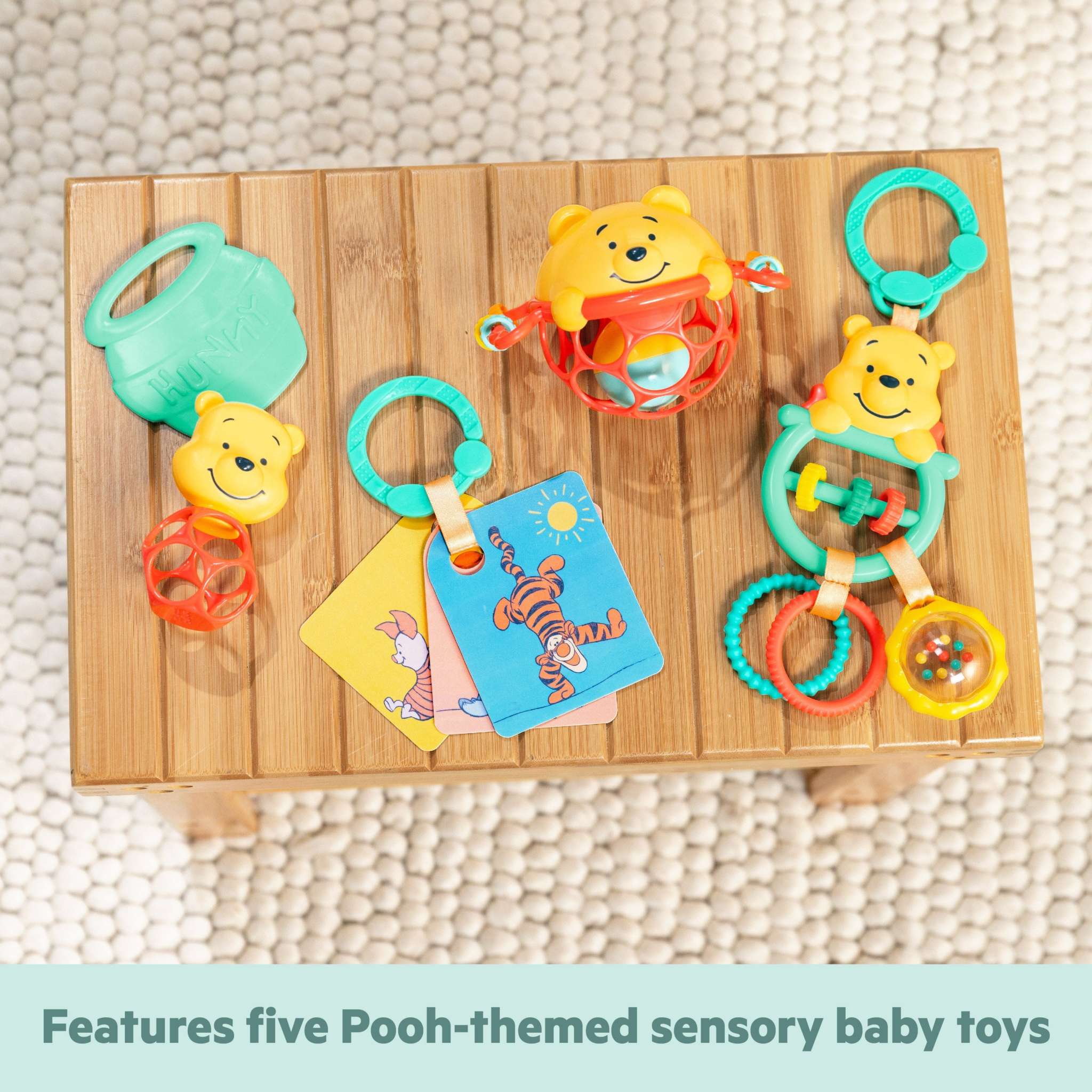 Disney Baby Winnie the Pooh sensory baby toy gift set with teether, rattle, Oball, activity toy, and flash cards