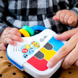 Baby playing with Baby Einstein Jingle & Jam colorful toy piano keys for sensory and motor skill development